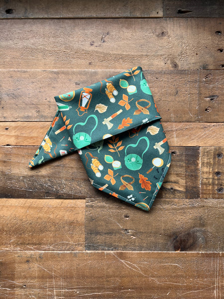 Wilderness Supplies on a Dark Green Background Dog Bandana