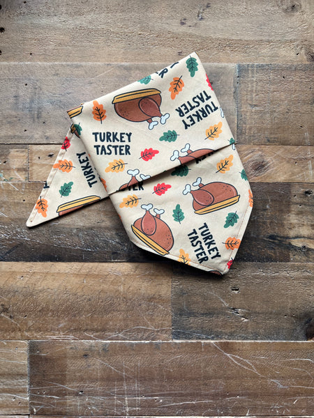 Turkey Taster Saying with Turkeys and Leaves Pattern on a beige background dog bandana