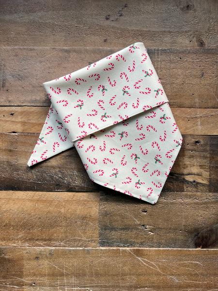 Dog Bandana with Cream background and repeating Red Candy Cane Pattern